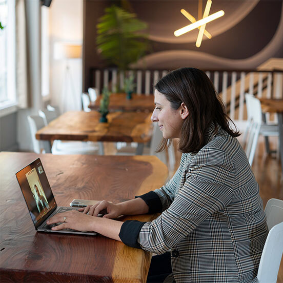 Woman on laptop in cafe